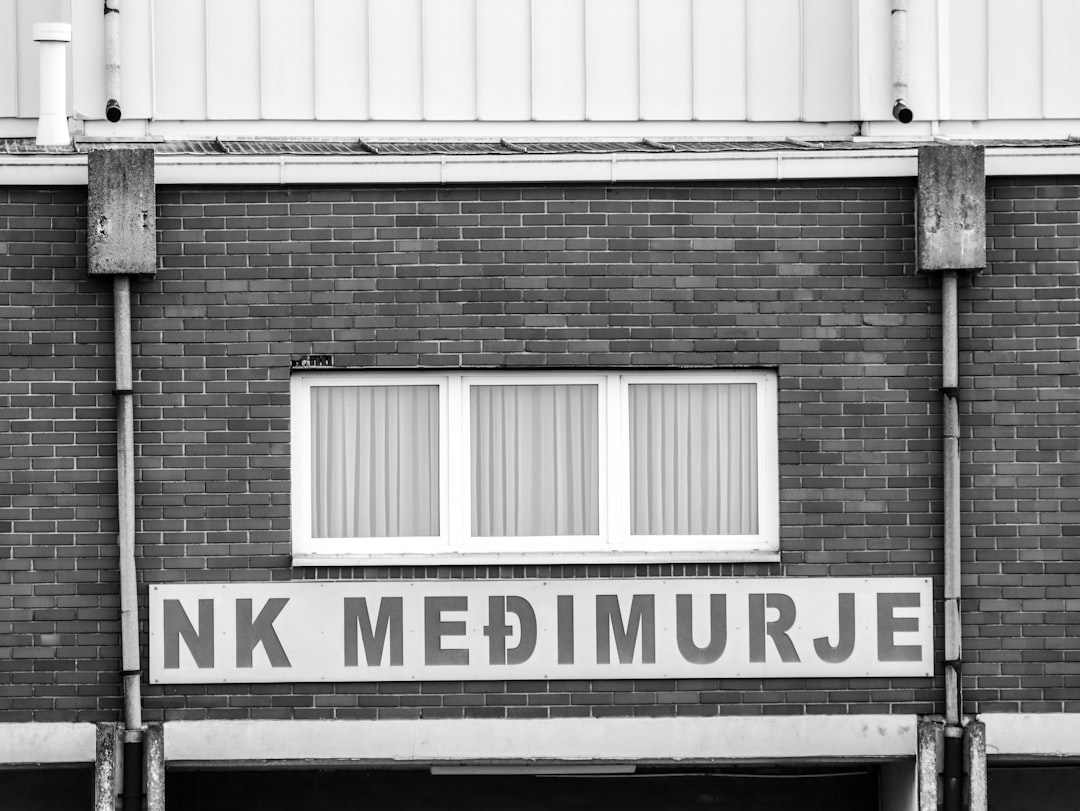 A black and white photo of a brick building
