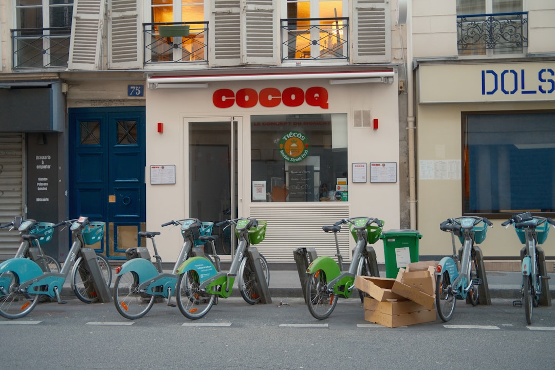 Bicycles parked outside a restaurant with a red sign